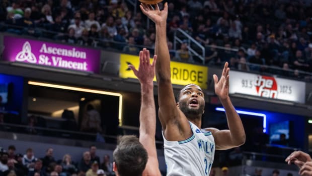 Minnesota Timberwolves forward TJ Warren (24) shoots the ball while Indiana Pacers guard T.J. McConnell (9) defends during the first half at Gainbridge Fieldhouse in Indianapolis on March 7, 2024.